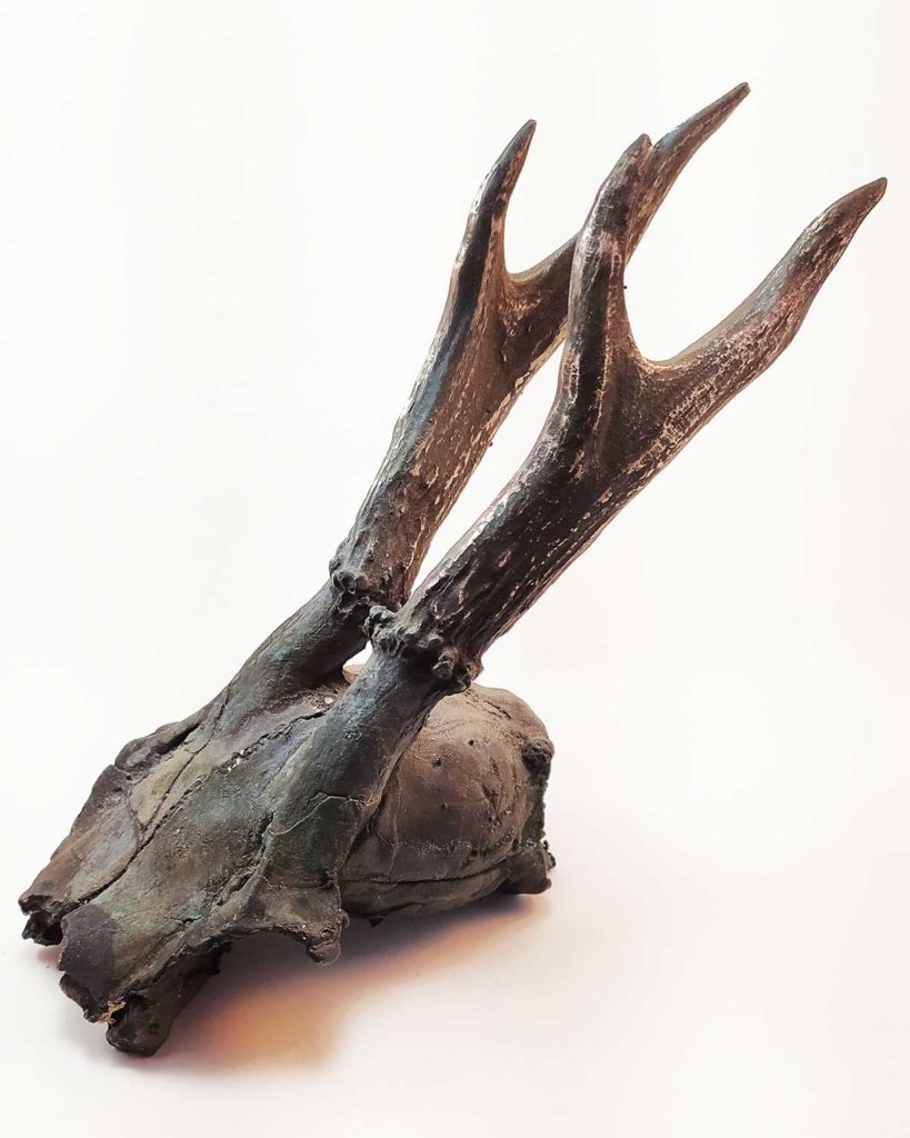 Bronze sculpture of a skull molded from a skull found in the Czech Republic