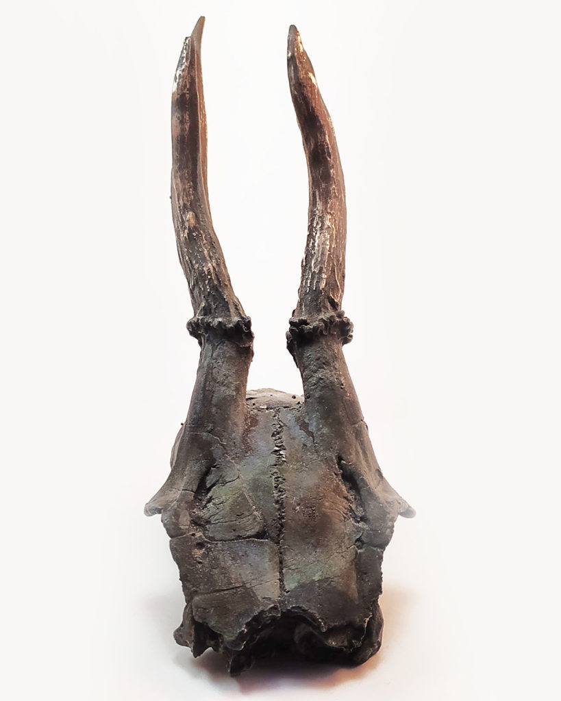 Bronze sculpture of a skull molded from a skull found in the Czech Republic